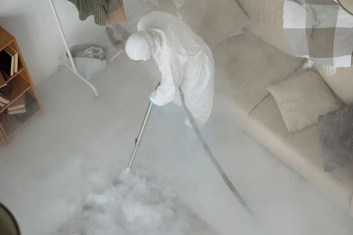 Biohazard cleanup technician in protective equipment, Southwest Germantown, Philadelphia, PA